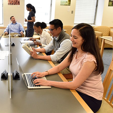 Johns Hopkins SAIS students in a library