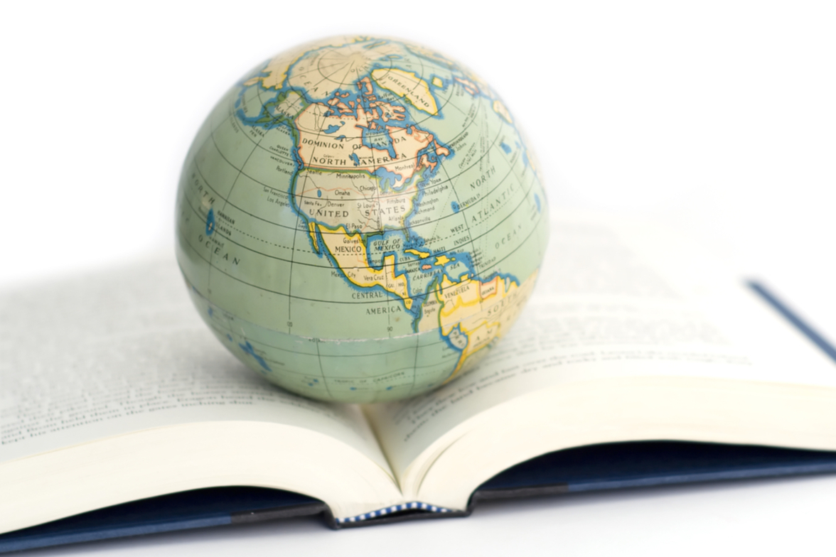 faculty ink image of a globe on an open book